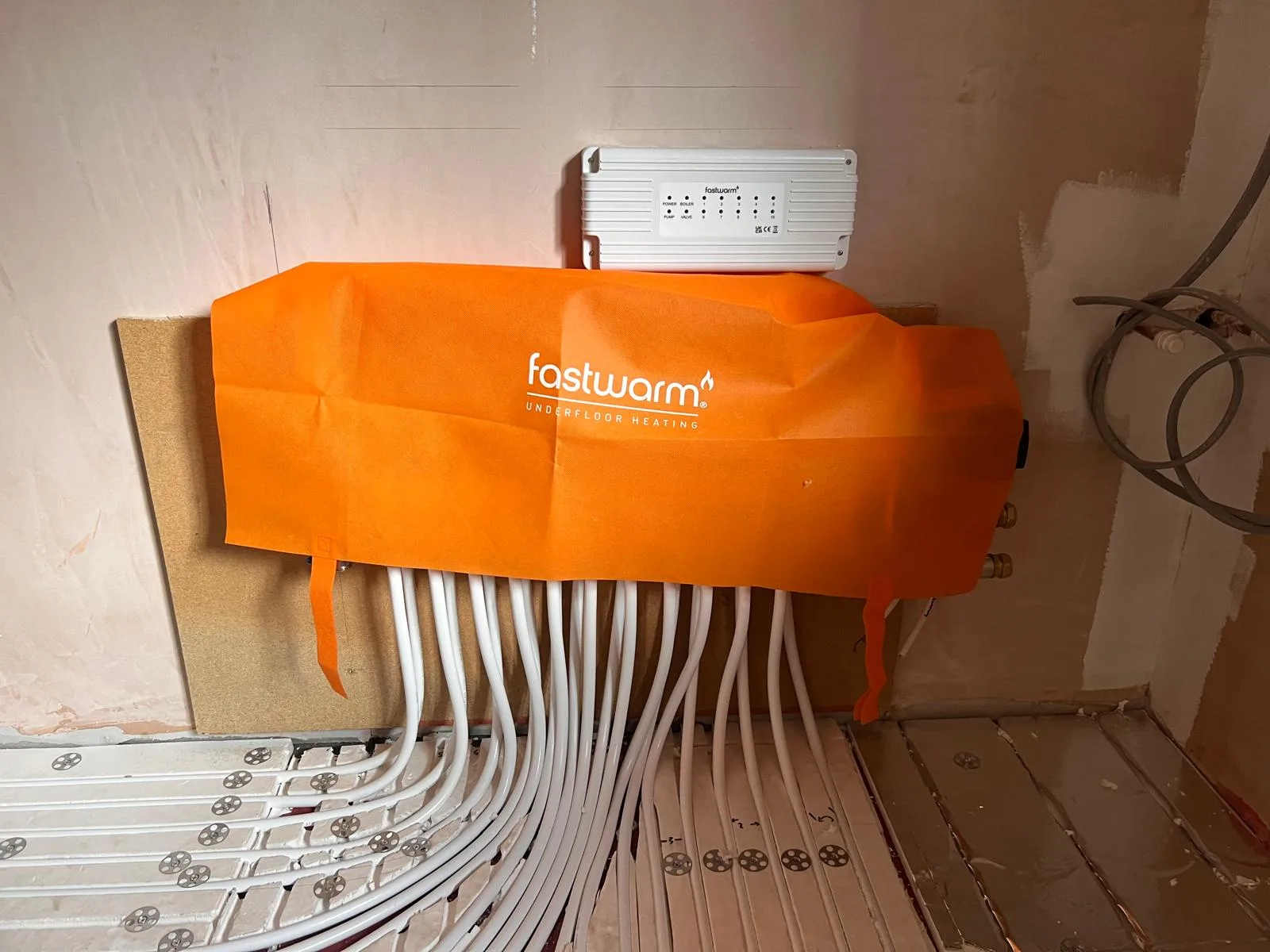 Underfloor heating manifold installed and connected
