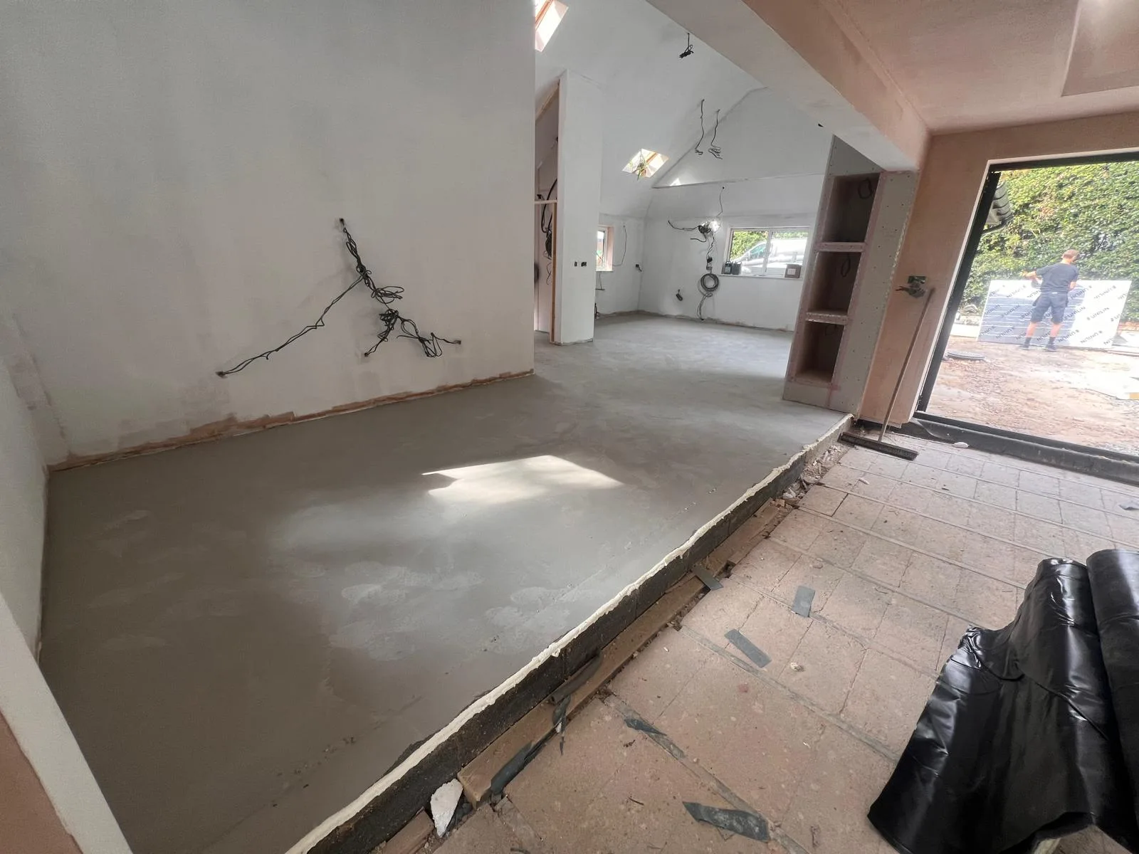 Screed poured over the underfloor heating circuits